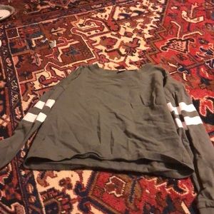 A green cropped long sleeve shirt